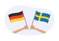 Germany and Sweden flags. German and Swedish national symbols. Hand holding waving flag. Vector Royalty Free Stock Photo